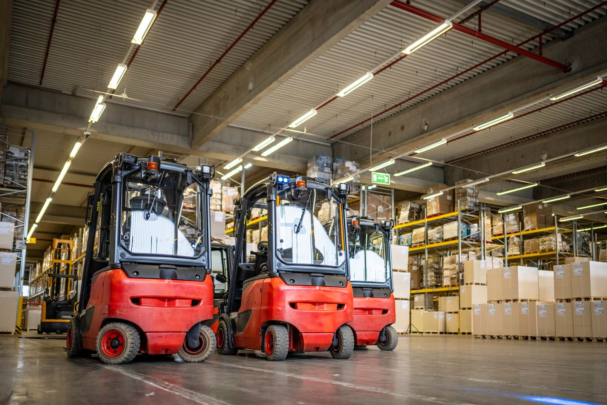 Forklifts and warehouse equipment in an industrial facility