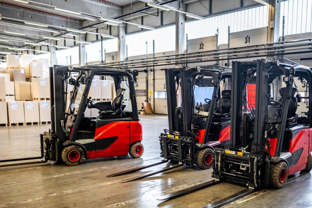 Forklift vehicles in warehouse with no people
