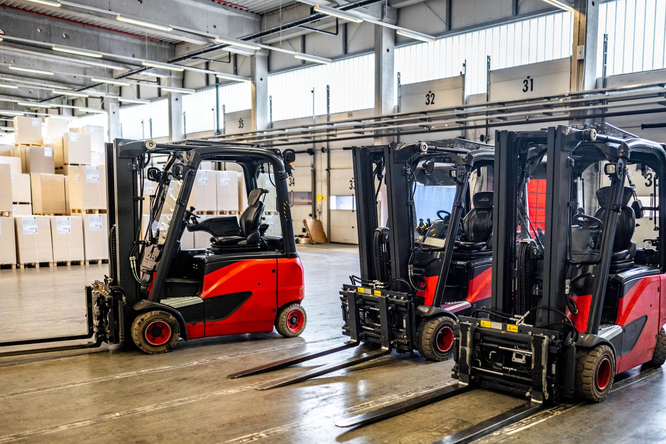 Forklift vehicles in warehouse with no people